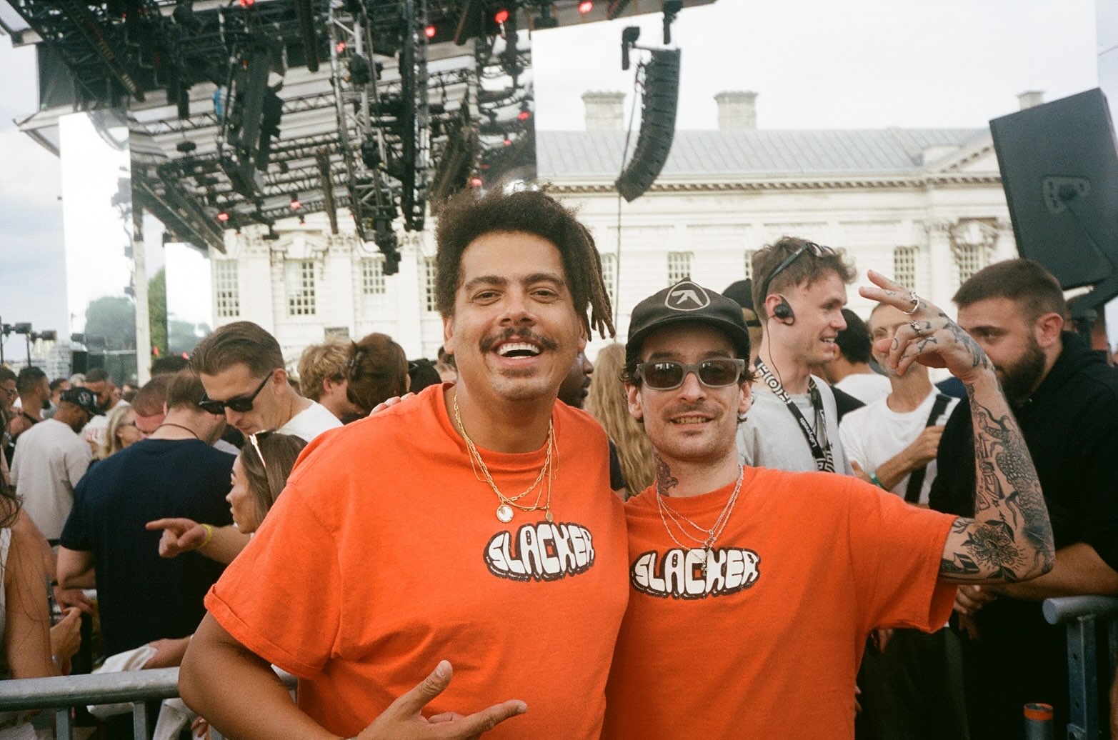 James of NO STYLIST and Seth Troxler wearing matching orange Slacker shirts
