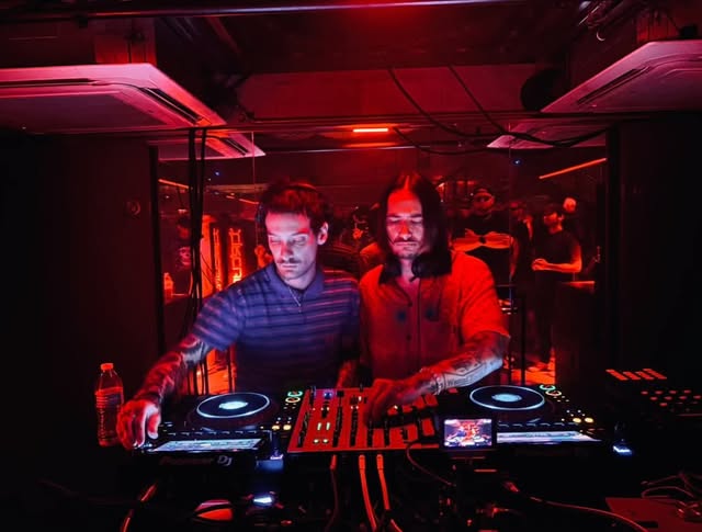 NO STYLIST performing together behind the decks at a CIRCUIT event under red lighting